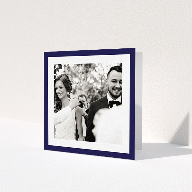 A photo wedding thank you card design named 'Navy Border'. It is a square (148mm x 148mm) card in a square orientation. It is a photographic photo wedding thank you card with room for 1 photo. 'Navy Border' is available as a folded card, with tones of blue and white.
