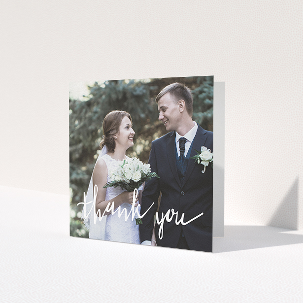 A photo wedding thank you card design called 'New to calligraphy'. It is a square (148mm x 148mm) card in a square orientation. It is a photographic photo wedding thank you card with room for 1 photo. 'New to calligraphy' is available as a folded card, with mainly white colouring.