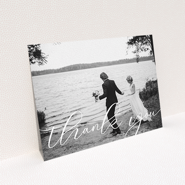 A photo wedding thank you card design titled "One Photo". It is an A6 card in a landscape orientation. It is a photographic photo wedding thank you card with room for 1 photo. "One Photo" is available as a flat card, with mainly white colouring.