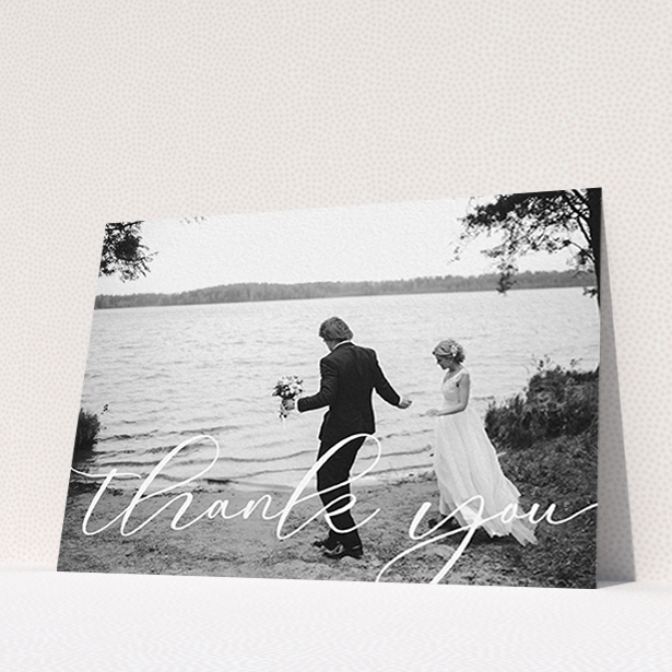 A photo wedding thank you card design titled "One Photo". It is an A6 card in a landscape orientation. It is a photographic photo wedding thank you card with room for 1 photo. "One Photo" is available as a flat card, with mainly white colouring.