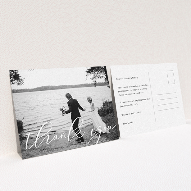 A photo wedding thank you card design titled "One Photo". It is an A6 card in a landscape orientation. It is a photographic photo wedding thank you card with room for 1 photo. "One Photo" is available as a flat card, with mainly white colouring.