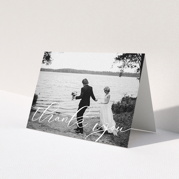 A photo wedding thank you card design named 'One Photo'. It is an A6 card in a landscape orientation. It is a photographic photo wedding thank you card with room for 1 photo. 'One Photo' is available as a folded card, with mainly white colouring.