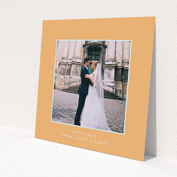 A photo wedding thank you card design called 'Orange and blue'. It is a square (148mm x 148mm) card in a square orientation. It is a photographic photo wedding thank you card with room for 1 photo. 'Orange and blue' is available as a flat card, with tones of orange and blue.