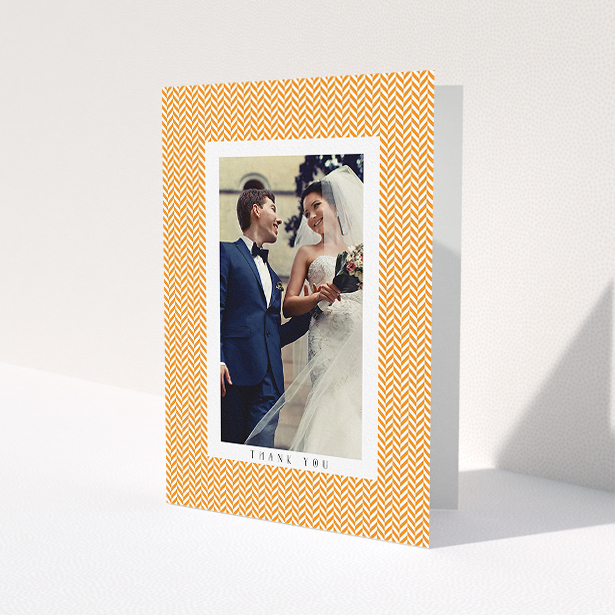 A photo wedding thank you card design named 'Orange Houndstooth'. It is an A5 card in a portrait orientation. It is a photographic photo wedding thank you card with room for 1 photo. 'Orange Houndstooth' is available as a folded card, with tones of orange and white.
