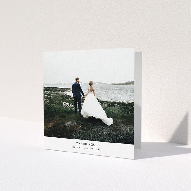 A photo wedding thank you card design named 'Sans Serif'. It is a square (148mm x 148mm) card in a square orientation. It is a photographic photo wedding thank you card with room for 1 photo. 'Sans Serif' is available as a folded card, with mainly white colouring.