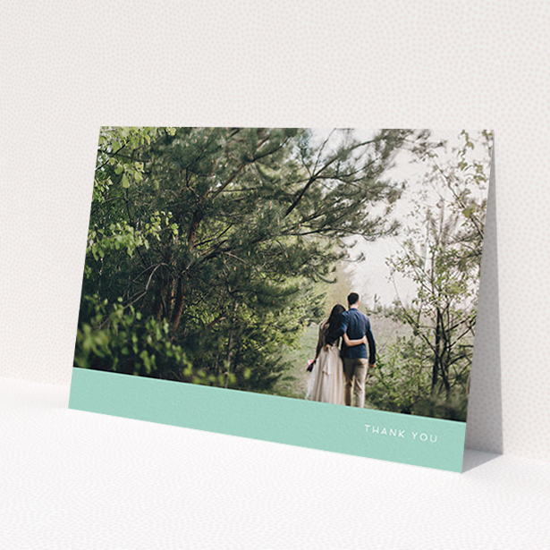 A photo wedding thank you card design called 'Simple Mint'. It is an A6 card in a landscape orientation. It is a photographic photo wedding thank you card with room for 1 photo. 'Simple Mint' is available as a flat card, with tones of green and white.