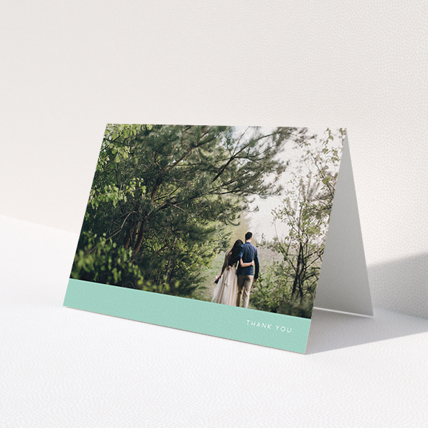 A photo wedding thank you card template titled 'Simple Mint'. It is an A6 card in a landscape orientation. It is a photographic photo wedding thank you card with room for 1 photo. 'Simple Mint' is available as a folded card, with tones of green and white.
