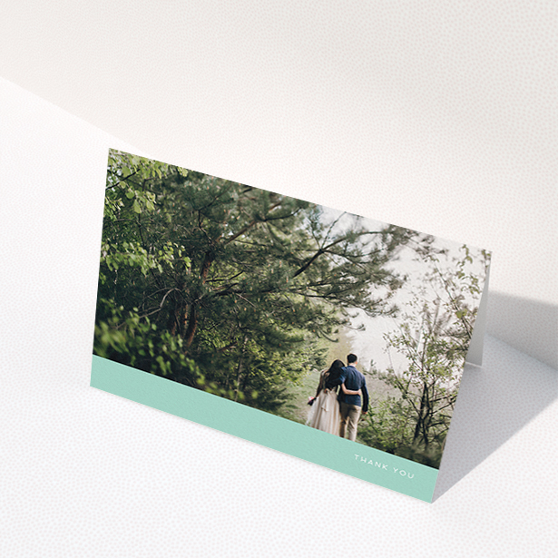 A photo wedding thank you card template titled "Simple Mint". It is an A6 card in a landscape orientation. It is a photographic photo wedding thank you card with room for 1 photo. "Simple Mint" is available as a folded card, with tones of green and white.