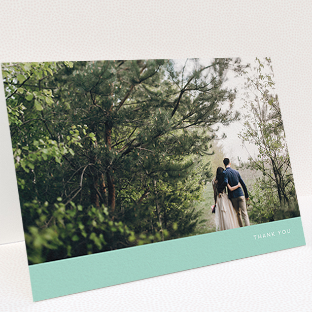 A photo wedding thank you card template titled "Simple Mint". It is an A6 card in a landscape orientation. It is a photographic photo wedding thank you card with room for 1 photo. "Simple Mint" is available as a folded card, with tones of green and white.