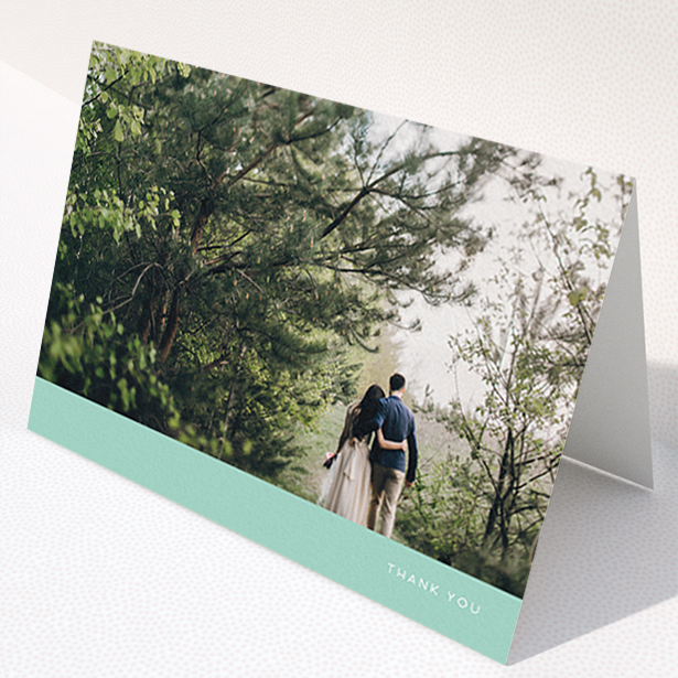 A photo wedding thank you card template titled "Simple Mint". It is an A6 card in a landscape orientation. It is a photographic photo wedding thank you card with room for 1 photo. "Simple Mint" is available as a folded card, with tones of green and white.