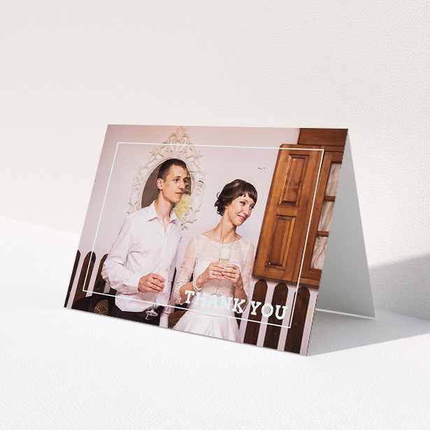 A photo wedding thank you card called 'Simple Thank You Frame'. It is an A5 card in a landscape orientation. It is a photographic photo wedding thank you card with room for 1 photo. 'Simple Thank You Frame' is available as a folded card, with mainly white colouring.
