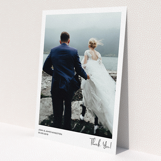 A photo wedding thank you card design called 'Simple Wedding Thank You'. It is an A6 card in a portrait orientation. It is a photographic photo wedding thank you card with room for 1 photo. 'Simple Wedding Thank You' is available as a flat card, with mainly white colouring.