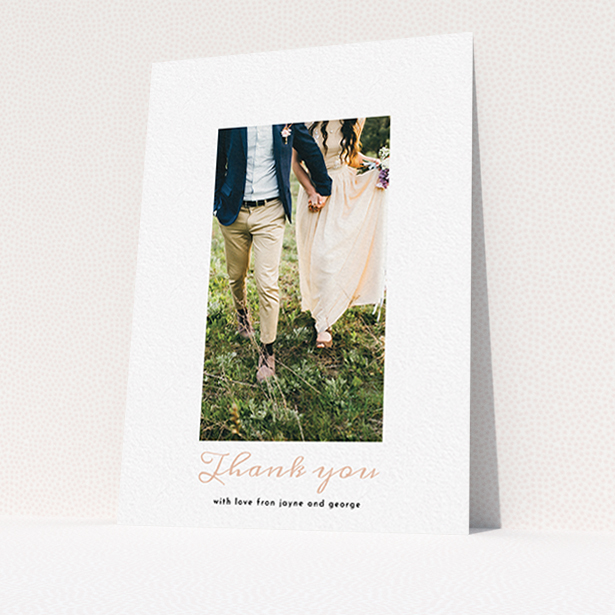 A photo wedding thank you card called "Small and Central". It is an A6 card in a portrait orientation. It is a photographic photo wedding thank you card with room for 1 photo. "Small and Central" is available as a flat card, with tones of white and pink.