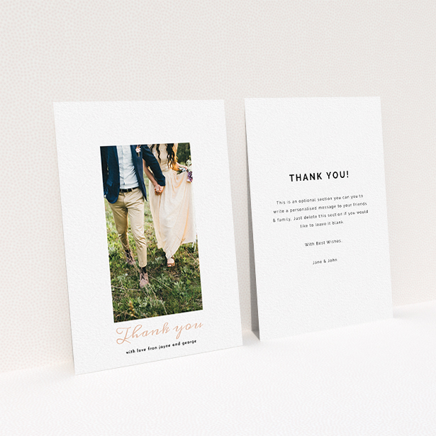 A photo wedding thank you card called "Small and Central". It is an A6 card in a portrait orientation. It is a photographic photo wedding thank you card with room for 1 photo. "Small and Central" is available as a flat card, with tones of white and pink.