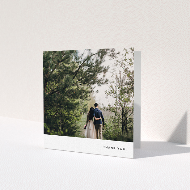 A photo wedding thank you card called 'Thankful with Simplicity'. It is a square (148mm x 148mm) card in a square orientation. It is a photographic photo wedding thank you card with room for 1 photo. 'Thankful with Simplicity' is available as a folded card, with mainly white colouring.