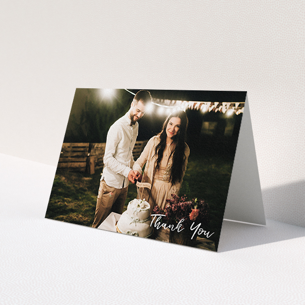 A photo wedding thank you card called 'Thanks From The Corner'. It is an A6 card in a landscape orientation. It is a photographic photo wedding thank you card with room for 1 photo. 'Thanks From The Corner' is available as a folded card, with mainly white colouring.