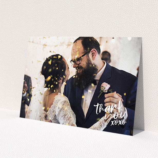 A photo wedding thank you card called 'Thanks In the Corner'. It is an A6 card in a landscape orientation. It is a photographic photo wedding thank you card with room for 1 photo. 'Thanks In the Corner' is available as a flat card, with mainly white colouring.
