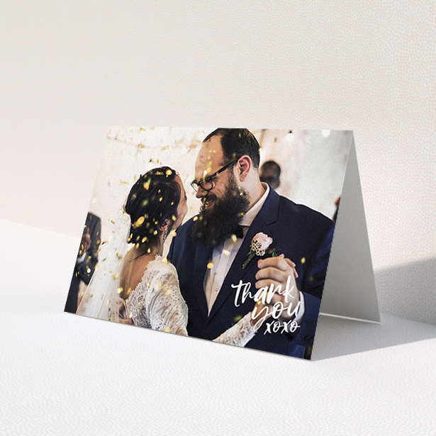 A photo wedding thank you card design titled 'Thanks In the Corner'. It is an A6 card in a landscape orientation. It is a photographic photo wedding thank you card with room for 1 photo. 'Thanks In the Corner' is available as a folded card, with mainly white colouring.