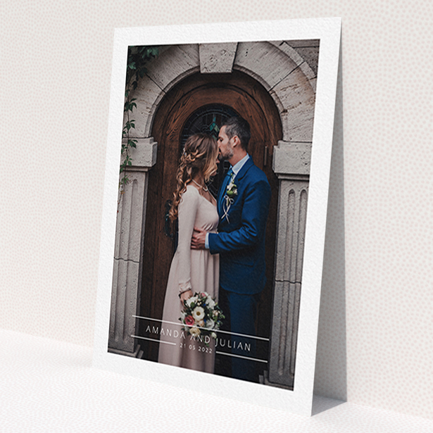 A photo wedding thank you card design called 'Tramlines'. It is an A6 card in a portrait orientation. It is a photographic photo wedding thank you card with room for 1 photo. 'Tramlines' is available as a flat card, with mainly white colouring.