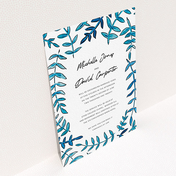 A wedding invite card design named "Blue Branch Swirl". It is an A6 invite in a portrait orientation. "Blue Branch Swirl" is available as a flat invite, with tones of blue and white.