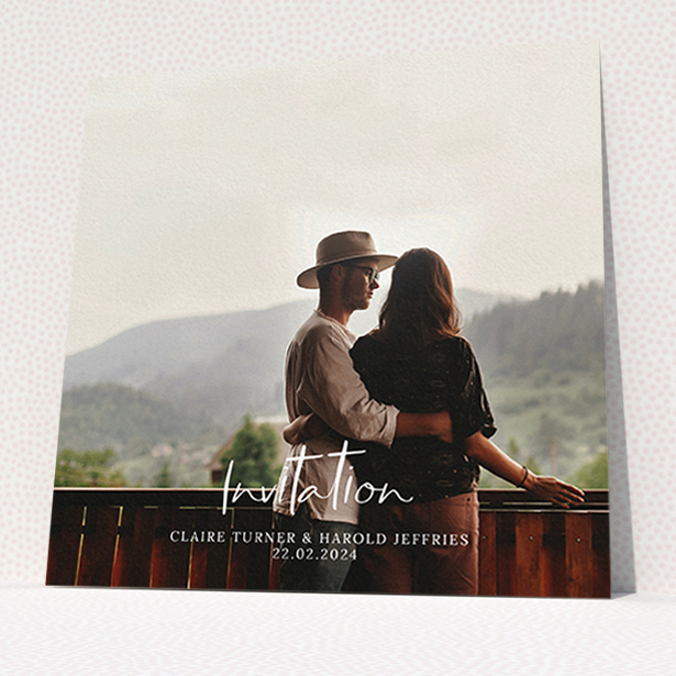 A wedding invite card named "Central Script". It is a square (148mm x 148mm) invite in a square orientation. It is a photographic wedding invite card with room for 1 photo. "Central Script" is available as a flat invite, with mainly white colouring.