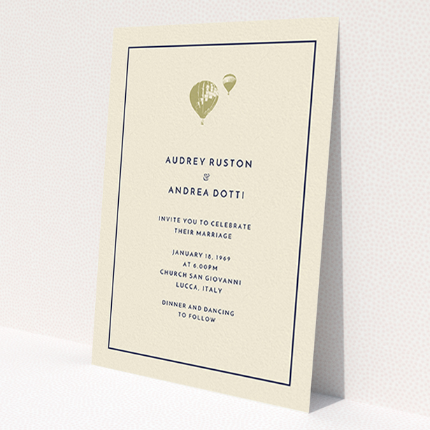 A wedding invite card design called 'Off and away'. It is an A6 invite in a portrait orientation. 'Off and away' is available as a flat invite, with tones of cream and gold.