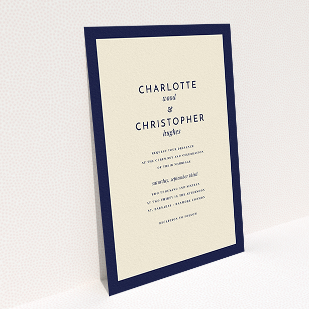 A wedding invite card named "Script switch". It is an A6 invite in a portrait orientation. "Script switch" is available as a flat invite, with tones of cream and navy blue.