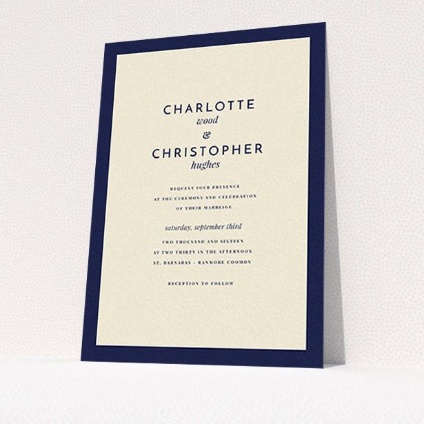 A wedding invite card named "Script switch". It is an A6 invite in a portrait orientation. "Script switch" is available as a flat invite, with tones of cream and navy blue.