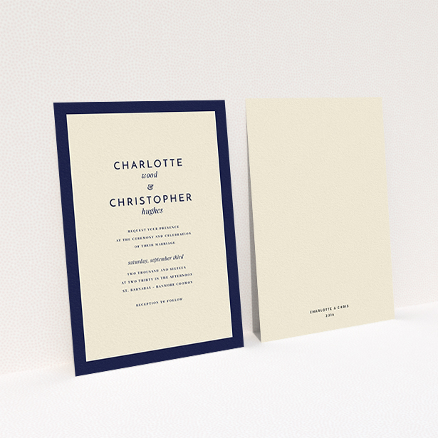 A wedding invite card named "Script switch". It is an A6 invite in a portrait orientation. "Script switch" is available as a flat invite, with tones of cream and navy blue.