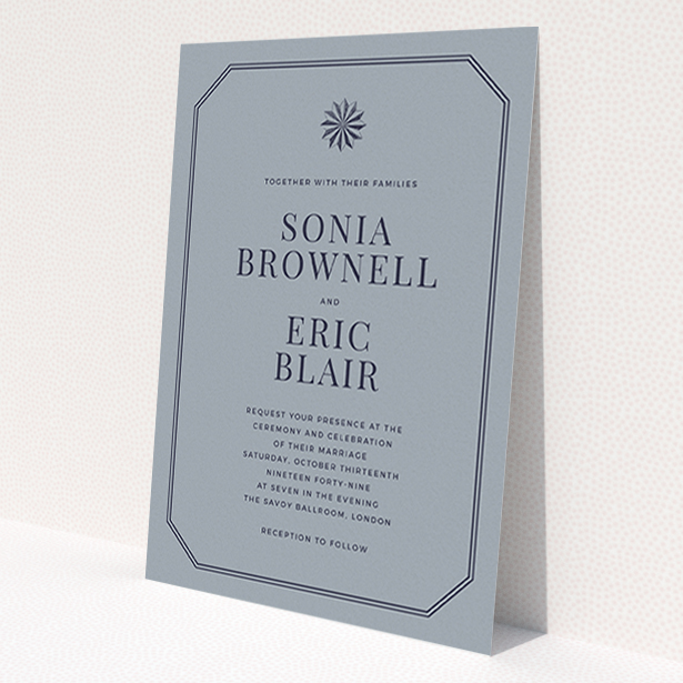 A wedding invite card named 'Shaded sundial'. It is an A6 invite in a portrait orientation. 'Shaded sundial' is available as a flat invite, with tones of dark grey and navy blue.