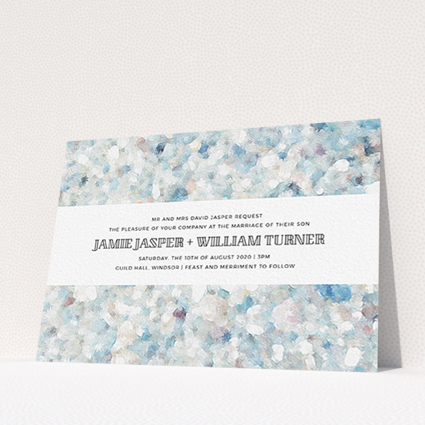 A wedding invite card design titled "Speckled Oils". It is an A6 invite in a landscape orientation. "Speckled Oils" is available as a flat invite, with tones of light blue, light grey and white.