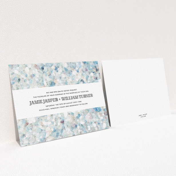 A wedding invite card design titled "Speckled Oils". It is an A6 invite in a landscape orientation. "Speckled Oils" is available as a flat invite, with tones of light blue, light grey and white.