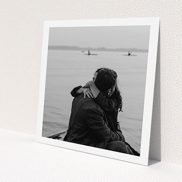 A wedding invite card design called 'Thick White Framed Photo'. It is a square (148mm x 148mm) invite in a square orientation. It is a photographic wedding invite card with room for 1 photo. 'Thick White Framed Photo' is available as a flat invite.