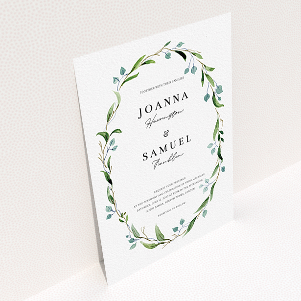 A wedding invite card called "Thin Watercolour Wreath". It is an A6 invite in a portrait orientation. "Thin Watercolour Wreath" is available as a flat invite, with tones of blue and green.