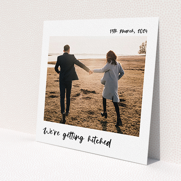 A wedding invite card design called 'Top and Bottom Photo'. It is a square (148mm x 148mm) invite in a square orientation. It is a photographic wedding invite card with room for 1 photo. 'Top and Bottom Photo' is available as a flat invite, with mainly white colouring.