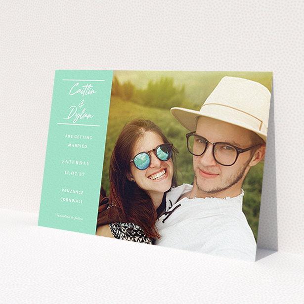 A wedding save the date called 'Bit on the side'. It is an A6 save the date in a landscape orientation. It is a photographic wedding save the date with room for 1 photo. 'Bit on the side' is available as a flat save the date, with tones of green and white.