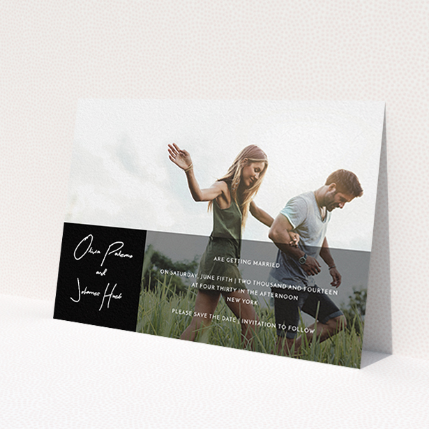 A wedding save the date card design named 'Black on black'. It is an A6 card in a landscape orientation. It is a photographic wedding save the date card with room for 1 photo. 'Black on black' is available as a flat card, with tones of black and white.