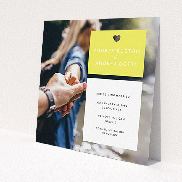 A wedding save the date card named 'Boxed In'. It is a square (148mm x 148mm) card in a square orientation. It is a photographic wedding save the date card with room for 1 photo. 'Boxed In' is available as a flat card, with mainly yellow colouring.