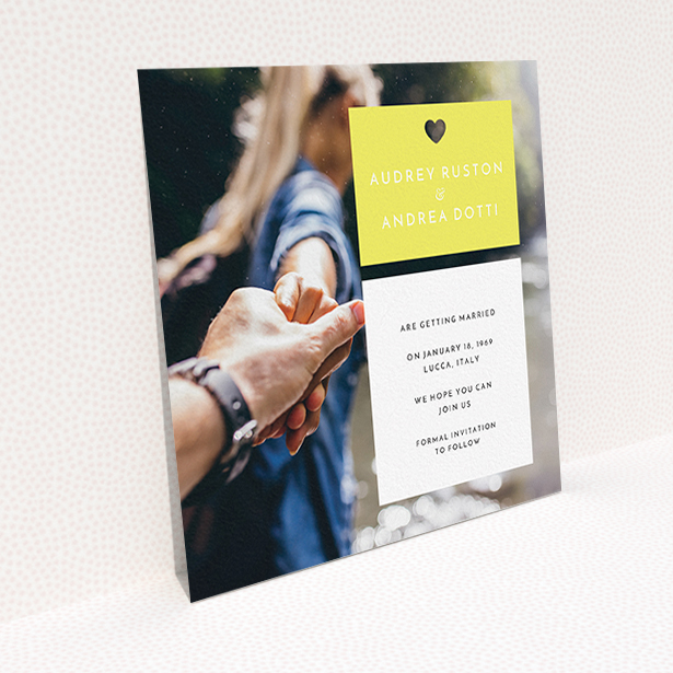 A wedding save the date card named "Boxed In". It is a square (148mm x 148mm) card in a square orientation. It is a photographic wedding save the date card with room for 1 photo. "Boxed In" is available as a flat card, with mainly yellow colouring.
