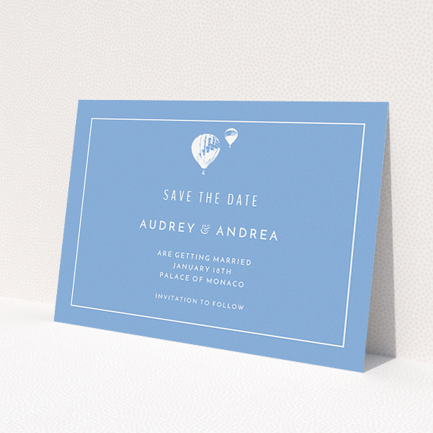 A wedding save the date card design named 'Off and away'. It is an A5 card in a landscape orientation. 'Off and away' is available as a flat card, with tones of blue and white.