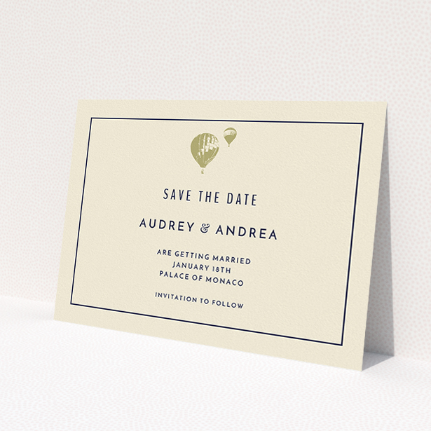 A wedding save the date card template titled 'Off and away'. It is an A5 card in a landscape orientation. 'Off and away' is available as a flat card, with tones of cream and gold.