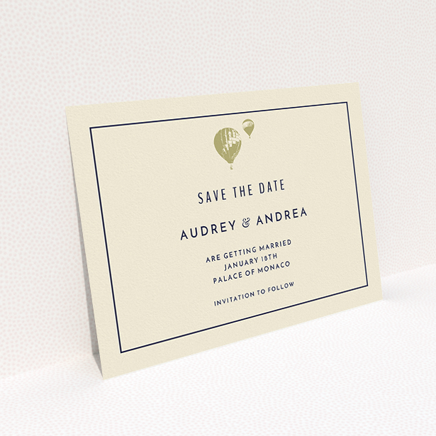A wedding save the date card template titled "Off and away". It is an A5 card in a landscape orientation. "Off and away" is available as a flat card, with tones of cream and gold.