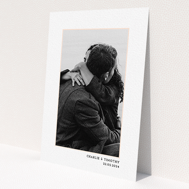 A wedding save the date card called 'Photo Centre'. It is an A6 card in a portrait orientation. It is a photographic wedding save the date card with room for 1 photo. 'Photo Centre' is available as a flat card, with tones of white and Pink.