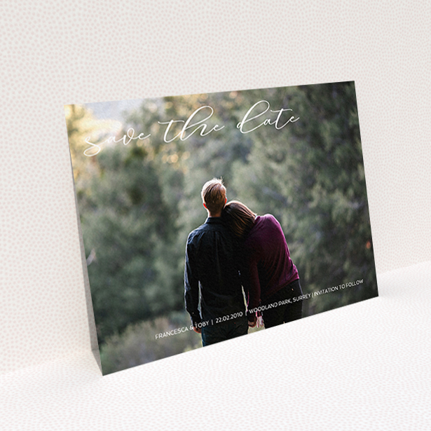 A wedding save the date card called "Photo Freedom". It is an A6 card in a landscape orientation. It is a photographic wedding save the date card with room for 1 photo. "Photo Freedom" is available as a flat card, with mainly white colouring.