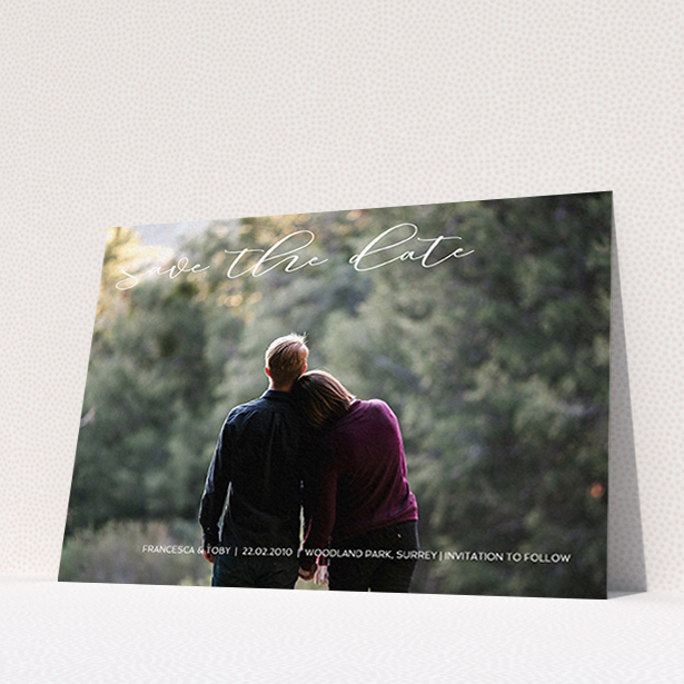 A wedding save the date card called "Photo Freedom". It is an A6 card in a landscape orientation. It is a photographic wedding save the date card with room for 1 photo. "Photo Freedom" is available as a flat card, with mainly white colouring.