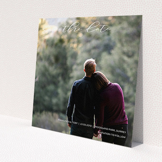 A wedding save the date card template titled 'Photo Freedom'. It is a square (148mm x 148mm) card in a square orientation. It is a photographic wedding save the date card with room for 1 photo. 'Photo Freedom' is available as a flat card, with mainly white colouring.