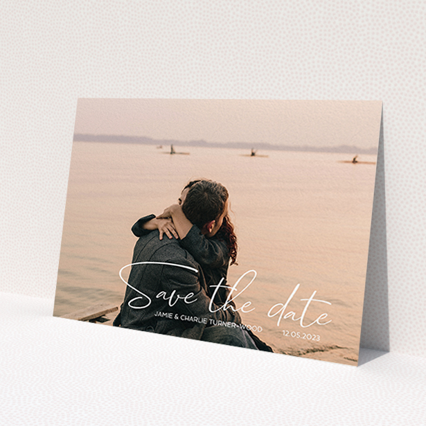 A wedding save the date card named 'Salamanca'. It is an A6 card in a landscape orientation. It is a photographic wedding save the date card with room for 1 photo. 'Salamanca' is available as a flat card, with mainly white colouring.