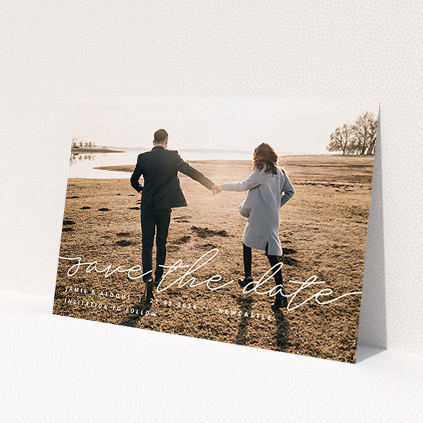 A wedding save the date card design titled 'Save the Date Script'. It is an A6 card in a landscape orientation. It is a photographic wedding save the date card with room for 1 photo. 'Save the Date Script' is available as a flat card, with mainly white colouring.
