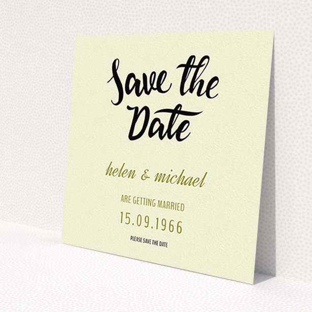 A wedding save the date card named 'Simply Black Typography Pen'. It is a square (148mm x 148mm) card in a square orientation. 'Simply Black Typography Pen' is available as a flat card, with tones of cream, gold and black.