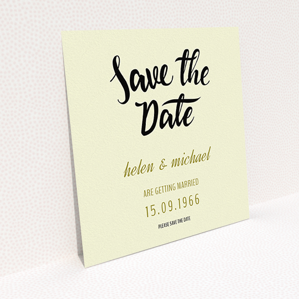 A wedding save the date card named "Simply Black Typography Pen". It is a square (148mm x 148mm) card in a square orientation. "Simply Black Typography Pen" is available as a flat card, with tones of cream, gold and black.